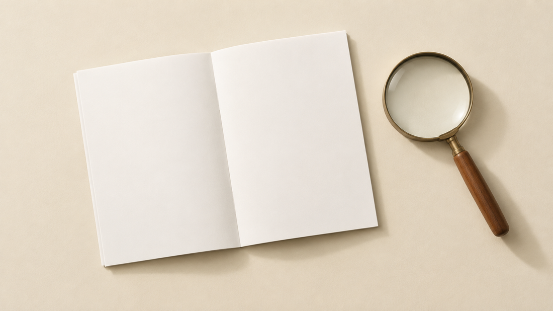 Illustrative blank booklet beside a magnifying glass; not a Vitamized label or product photograph.